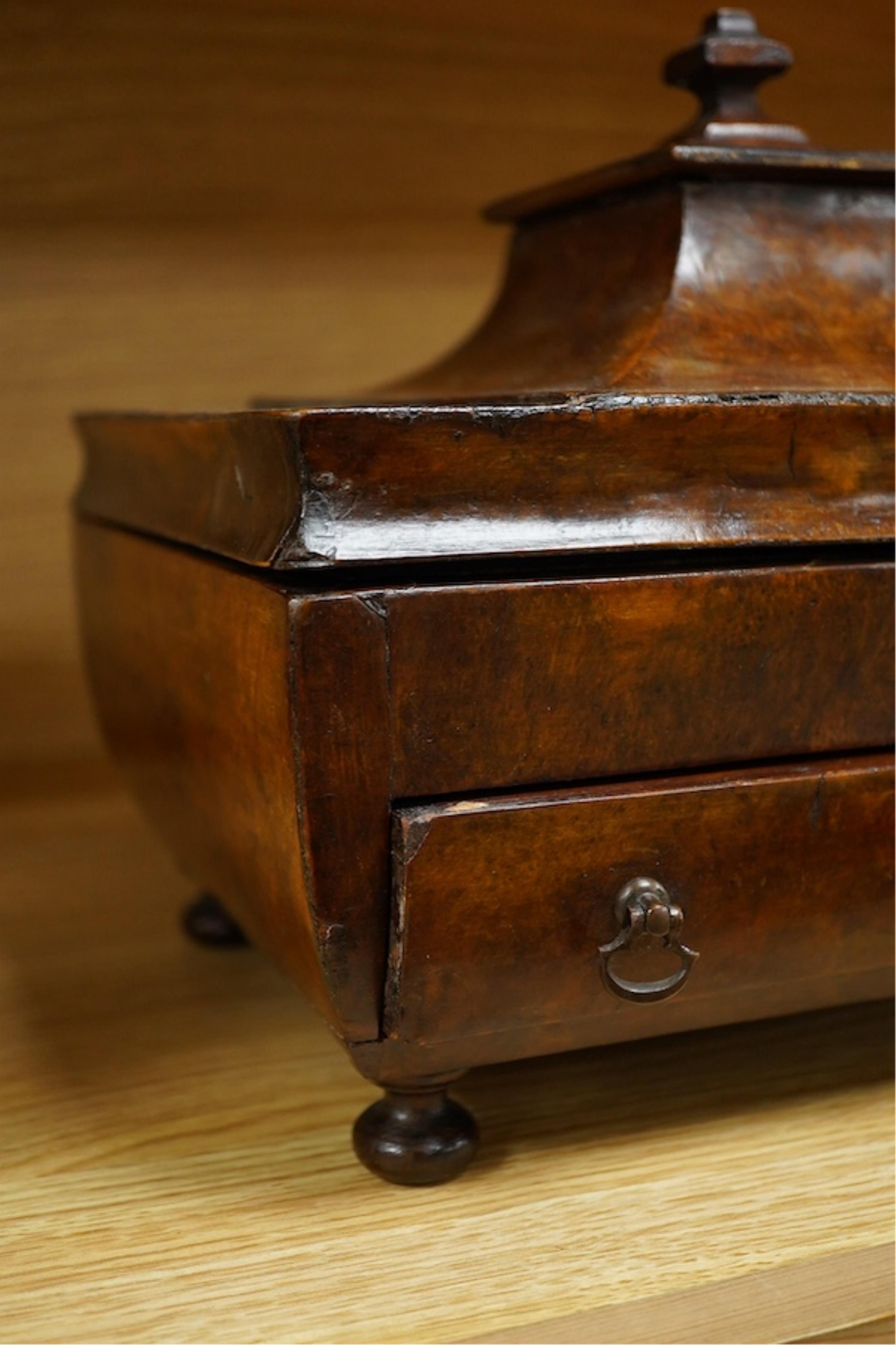 A Victorian burr walnut pagoda’ shaped sewing box incorporating a folding writing slope, 28cm wide. Condition - poor to fair